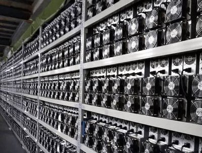 A large mining farm with rows of ASIC miners, showcasing the scale of operations and the need for proper infrastructure.