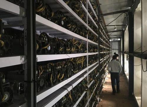 Close-up of a mining rig's circuit boards and cooling fans in operation